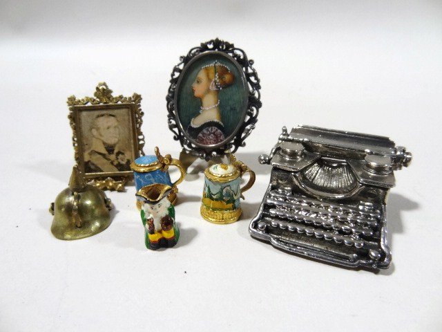 Antique Portrait Pin: A lot featuring a lovely hand-painted profile of a Florentine lady on ivory in a silver frame 800 parts silver 1 3/8" X 1 5/8", a pewter typewriter, an antique brass table frame with print of a Victor