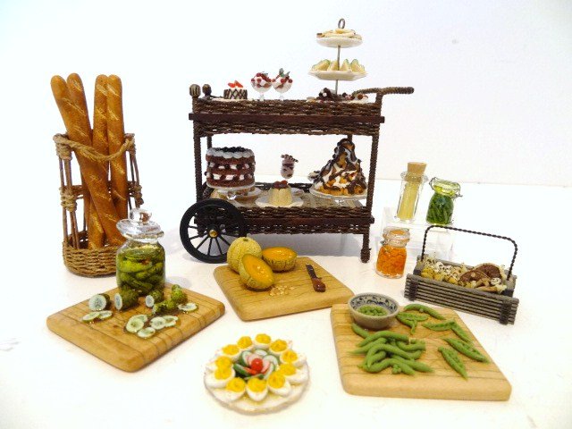 Jan Patrie Pastry Cart: Wonderful wicker pastry cart loaded with goodies 2.5" H, 3" L and other foodstuffs from the artist including canned veggies, bread, mushrooms, etc.