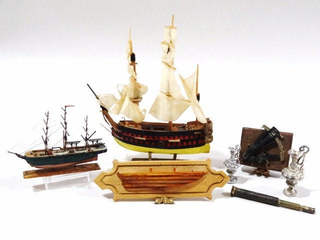 Ship Models: Two ship models by members of the Callahan family 3.5" H with a half-hull, trophy, telescope and sextant. The larger one has some loss.