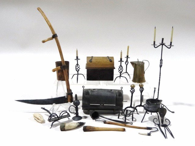 Jim Holmes Fireside Tools: Great collection of finely wrought iron lighting devices including a tall candlestand 4.25" H, a spider, toasting rack, wonderful andirons, etc. Also a tin meat hastener and wooden chest, wooden tools