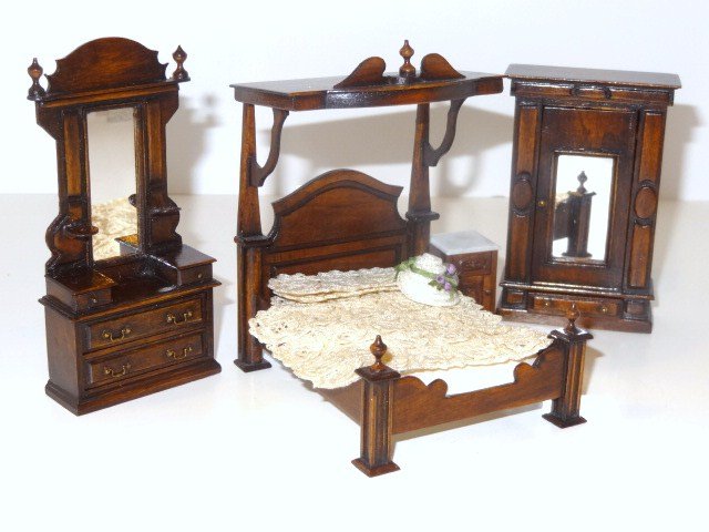 J. Gans Half-scale Bedroom Set: Four pieces of half-inch scale Victorian bedroom furniture comprising a half-tester bed 4.24" H, 3.5" L, 3" W, with matching armoire, mirrored chest and nightstand, by artisan J. Gans in 1982. Also an