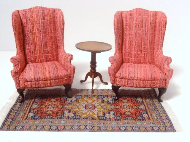 Upholstered Wing Chairs: A pair of colorful wing chairs from Central America 4" H, a very nicely crafted flip-top table signed Reifel, a pot of African violets and a woven oriental rug.