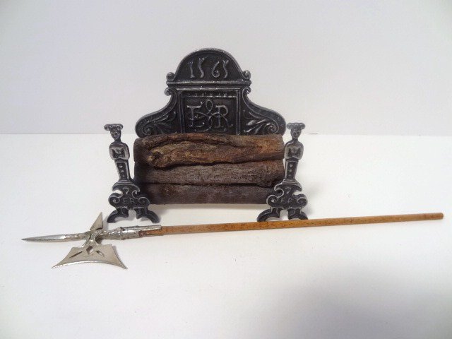 John Hodgson Fireback and Andirons: Combination cast metal fireback and andirons with stack of logs, nicely detailed. 2.75" H, 3.5" W. Also a polished steel halberd 7" L, very sharp.