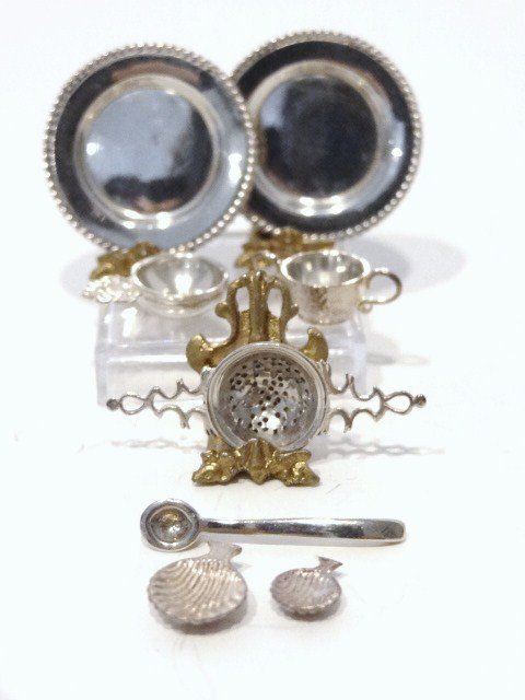 Obadiah Fisher 1/4 inch Scale Miniature Sterling: Dinner plate, candle snuffer, tea strainer, tea scoop, double handled cup, porringer, all 1/4 in. scale, all marked OF, 8 pcs.