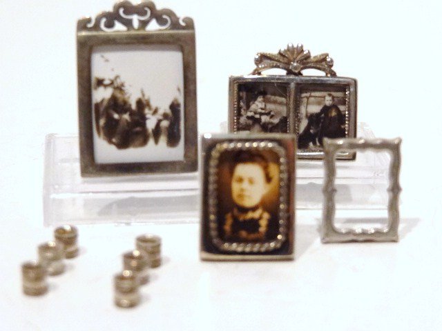 Enrique Quintanar Miniature Sterling: Four miniature sterling frames, one double, 3 w/vintage photos, together w/6 napkin rings, 3/4 in. tallest