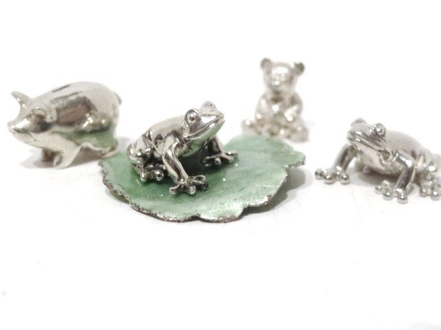 Peter Acquisto Miniature Sterling: Two Frog Table ornaments #166, one w/Ligia Durstenfeld silver enameled Lilly Pad Leaf, Teddy Bear Bank #134, Piggy Bank #146, all marked A Sterling, all approximately 1/2 in.