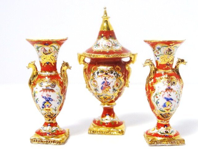 Tricia Street Porcelain Garniture: Breath-taking porcelain garniture set by English ceramicist Tricia Street comprising a covered urn 1.75" H with a pair of matching vases. Exquisite.