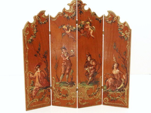 Natasha Folding Screen: Handsomely painted four-panel screen with scrolled top and elaborate gilt lacquer borders, four romantically posed musicians and three garland-bearing putti decorate the mahogany background. Painted b
