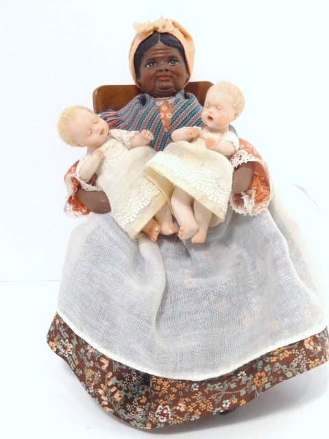 Amanda Skinner Babies and their Mammy: The seated mammy doll is by Carol Boyd and she holds a pair of jointed porcelain twins made by Amanda Skinner. Mammy is 5.5" H when standing. With a nicely crafted artisan rocker.