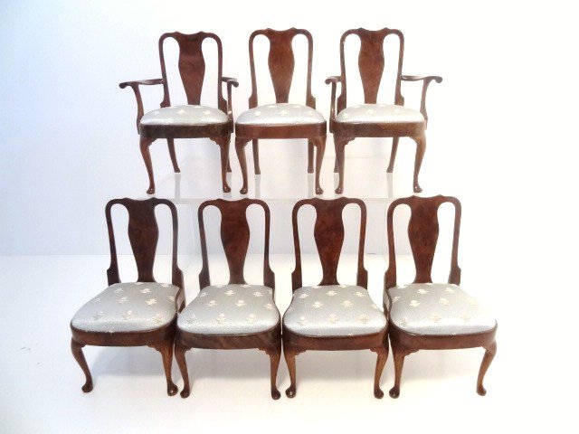 John Hodgson Queen Anne Chairs: A set of seven matching Queen Anne dining chairs, two carvers and five side chairs, with silk upholstered seats, 3.25" H, mahogany with walnut veneers and are made of real wood, not resin. Dated 1987.