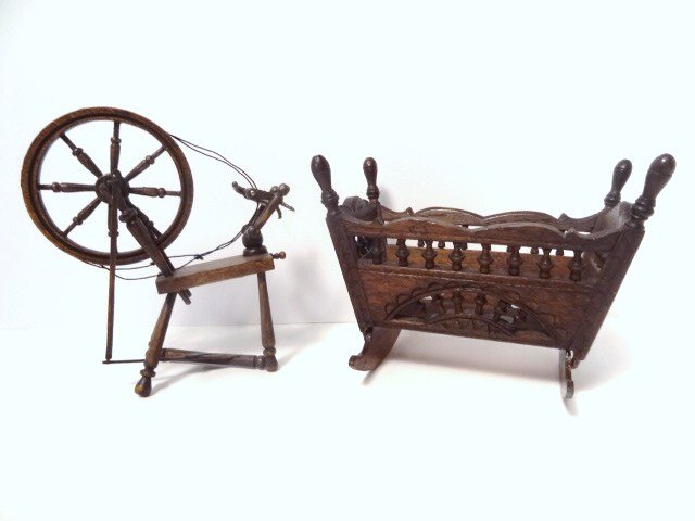 Vintage Breton Cradle: Purchased from Mell Prescott, a vintage walnut Breton-style cradle said to have been previously owned by Mrs. James Ward Thorne 3.25" H, 4" L, and a small spinning wheel (string needs tightening), pre
