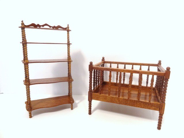 Gerald Crawford Victorian Crib: Signed and dated 1980, a mahogany crib with spool-turned spindles 2.75" H, 3.5" L. With a Verl Kraeger five-tiered mahogany what-not 4.5" H.