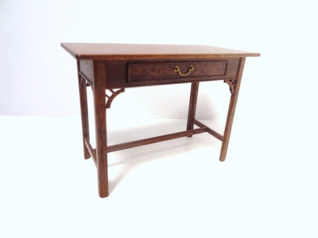 Gerald Crawford One-Drawer Table: Handsome mahogany table with decorative fretwork details, braced base, very nice proportions. 2.5" H, 3.5" L. Slight wax residue on top, easily cleaned.