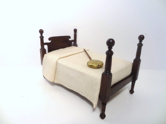 Paul Moore Cannonball Bed: A traditional mahogany bed with prominent cannonball finials 4.5" H, 7" L, 4" W with a handwoven damask-weave coverlet and an etched brass bed warmer. Headboard slightly loose. Unsigned, custom-made f