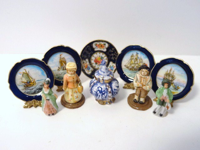 Christopher Whitford Plates: A single Derby plate 7/8" diameter and set of plates with hand-painted naval scenes by the same artist. Also an unsigned Delft covered vase and four English figurines, two signed C.P.