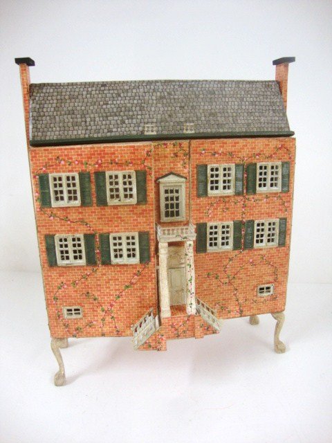 Charlotte Scott Georgian Cabinet House: Made from a Jean McLean kit, assembled and finished by Charlotte Scott, an elegant English manor house on its own stand, opens to reveal a 6 room baby house. 6" H, 5.5" W.