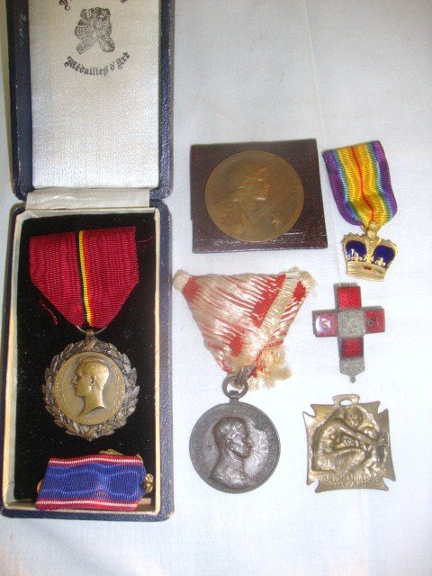 WWI European Bravery Medals, 7 pieces: Lot includes 1915 Bulgarian WWI Red Cross Badge awarded for bravery on the field, silver, other medal & enamel 1 1/4 x 1 in., Renee Lalique bronze badge ORPHELINAT DES ARMEES, signed R.Lalique 1 1/4 x