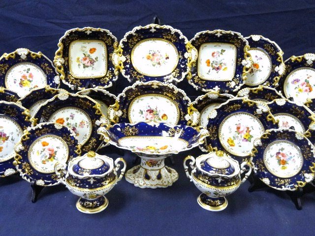 Old Paris Porcelain Dinner Service: Impressive Paris porcelain dinner service, 19th century, cobalt ground reserve w/polychrome, floral cartouche & foliate gilt decoration, includes 13 in. (l) x 6 in. (h) carbeille, 12 - 9 in. plates, 2