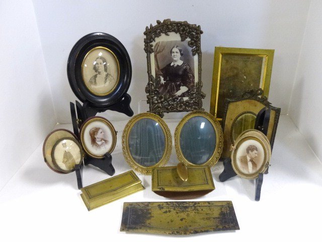 Grouping Early Photos and Desk Set: Includes shield shaded frame w/oval picture & gilt mounts, carved wood frame w/wedding photo, pair cased Victorian photos, 6 photos in medal frames & 19th century portrait in oval frame, plus signed B