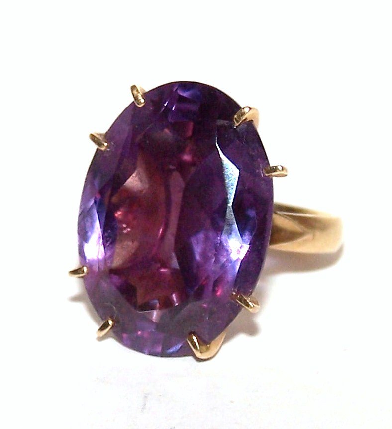 14K Large Alexandrite Ring: Large Alexandrite (color changing stone) Set in 14K Yellow Gold. 11.5g total weight. Stone is 22.5mm x 17mm in size