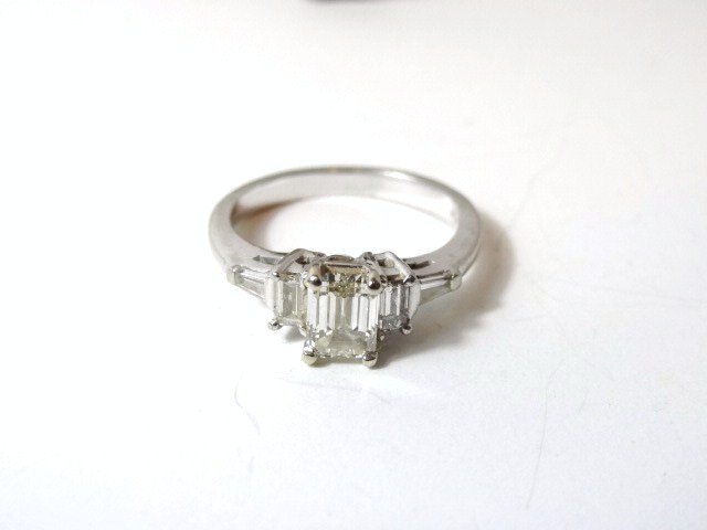 Platinum Emerald Cut 3 Stone Diamond Ring: Emerald Cut Diamond ring. Center Stone 1 Ct VX-1 H/I Color. 2 tapered Baguettes .20 ctw and 2 Straight Baguette Diamonds .20 ctw VVS-2 Color H in Platinum Setting 1.4ct TCW with Appraisal