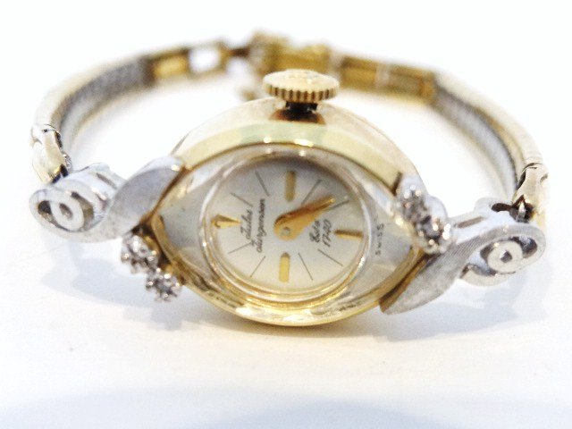 Ladies 14kt Jules Jorgensen Wrist Watch: Ladies 14kt White and Yellow Gold Wrist Watch with four small Diamond Chips, band is 1/20 10kgf, 15.2 grams total weight