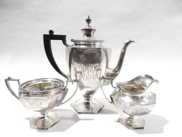 Sterling Tea Set: Three piece tea set w/open sugar bowl, creamer & ebony handled tea pot of hexagonal urn form on pedestal foot, the pot marked 2 PINTS, J.E. CALDWELL & CO 925/STERLING/1000/PHILADELPHIA & 4525, others
