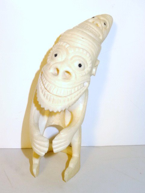 Greenland Eskimo Tupilak Carving: Carved whale tooth figure w/dyed baleen eyes of a tupilak, 5 in. (h)