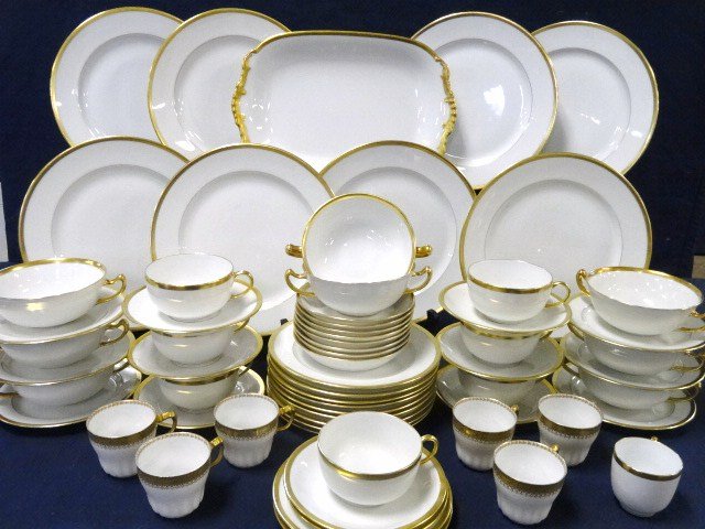 Limoges Service for Eight: Limoges 64 pcs. gold trim, 8 dinner plates, 8 plates, 8 bread plates, 8 dessert plates, 8 cream soup bowls, 7 cups, 8 saucers, 1 demi cup, platter, marked France, also includes 6 demi cups Haviland Li