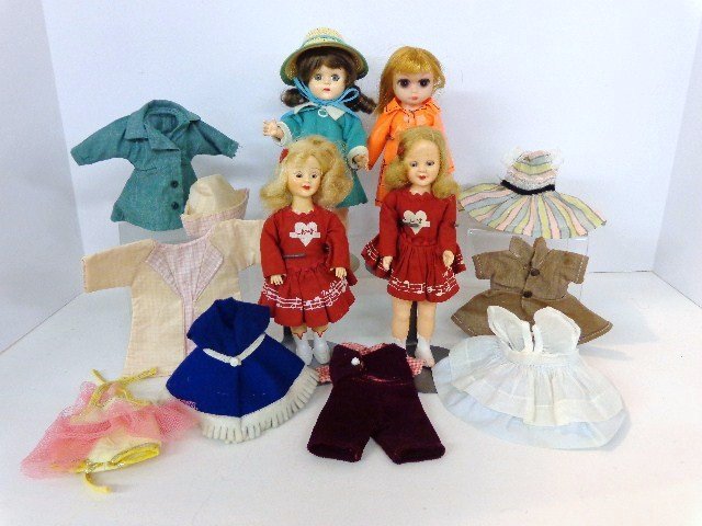 Four Small Dolls, Pam, Mary Hartline (2), Unmarked: Pam doll 8 in. in wicker basket w/extra clothes, 2 Ideal 7 1/2 in. Mary Hartline dolls, & 7 1/2 in. doll made in Hong Kong w/large eyes