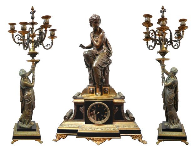 Napoleon III Three Piece Clock Garniture by Henri: Napoleon III Ormolu & black marble 3 pc. Clock garniture, by Henri Houdebine, Paris, 3 figures cast by E.Tienne - Henri Dumaige, artist, consists of a mantle clock & a pair of 6 light candleabra, the