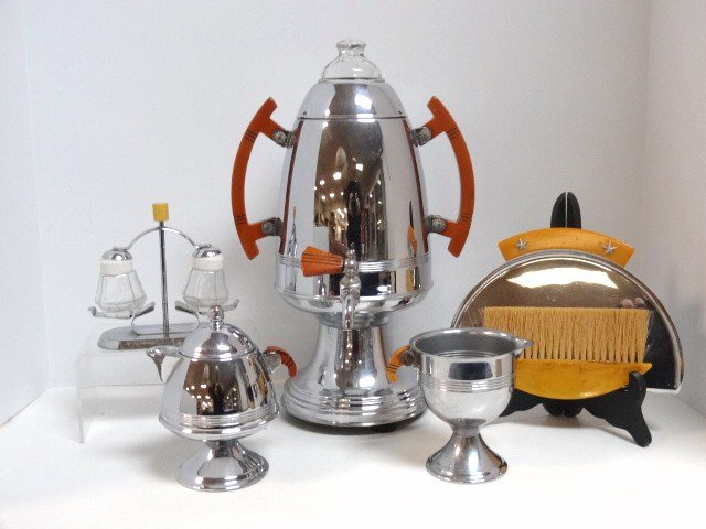 Art Deco Chrome Coffee Set and others: Very nice 3 pc. Art deco chrome coffee set w/brown Bakelite handles 13 1/2 in. (H), spring loaded chrome salt & pepper set, & a chase Bakelite & chrome crumb set in original box