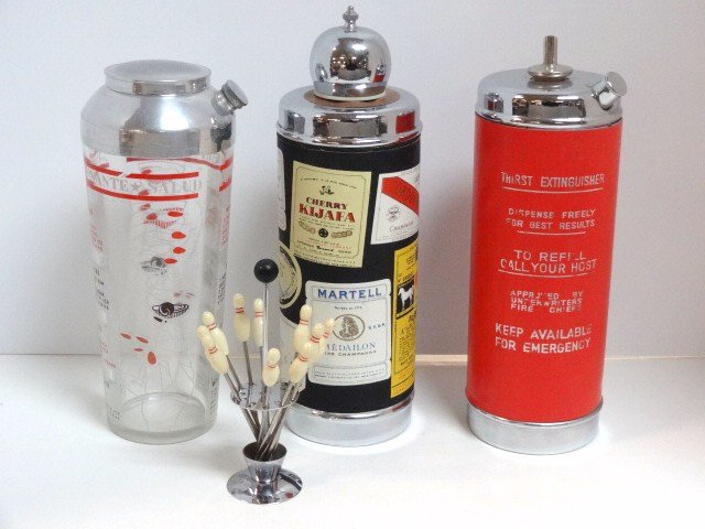 Musical Cocktail Shakers and Others: Musical cocktail shaker plays Last Time I Saw Paris marked Japan, 11 in. (H), Thirst Extinguisher cocktail shaker plays How Dry I Am marked Japan 10 1/2 in. (H), glass shaker w/recipes & a set of 10 b