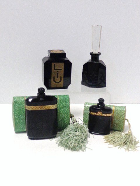 Guerlain & Caron Perfume Bottle: Guerlain Opague Black opague black glass perfumes, in green cardbord case with tassel, black glass perfume with etched stopper.