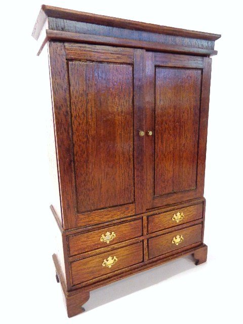 Jenvey Linen Cupboard: Classic Georgian mahogany linen press with five interior removable shelves (one warped), four lower drawers with Chippendale pulls. Small scratch on one drawer, tiny nicks along top of pediment. 6.75"