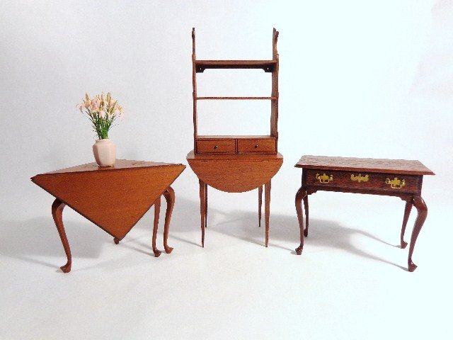 Edward Norton Tables: A mahogany Queen Anne dressing table 2.25" H, 3" W, a cherry handkerchief table and Pembroke table, and a wall shelf with two drawers and fishtail sides.