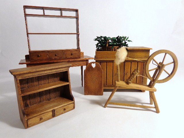 Hank Taylor Furniture: An unsigned dry sink 3" H, 3.75" W, a small wall shelf signed by Hank and Eleanor Taylor, a larger, unsigned shelf, a cutting board by David White, an unsigned walnut work table and a spinning wheel.