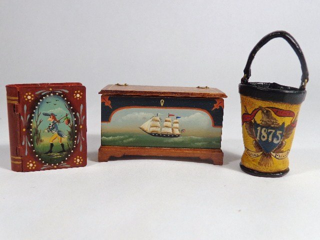 Therese Bahl Trunk and Fire Bucket: Utterly charming small painted chest with three-masted clipper 1 and 1/8" H, 2" W, a painted leather fire bucket and a book-shaped tin box with painted lid, all by Therese Bahl.