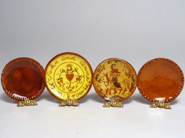 McKnight Sgraffito Plates: Two redware plates with sgraffito decoration, the larger 1" diameter, both by Debbie McKnight, and two beautifully glazed unsigned redware plates with crimped rims.