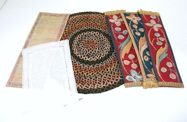 Assorted Rugs and Runners: A vintage fine gauge rayon braided rug about 11" diameter (small stain), three Cornish tapestry bookmarks suitable for carpet runners, a Keshishian runner 4" X 10" and a finely embroidered white table