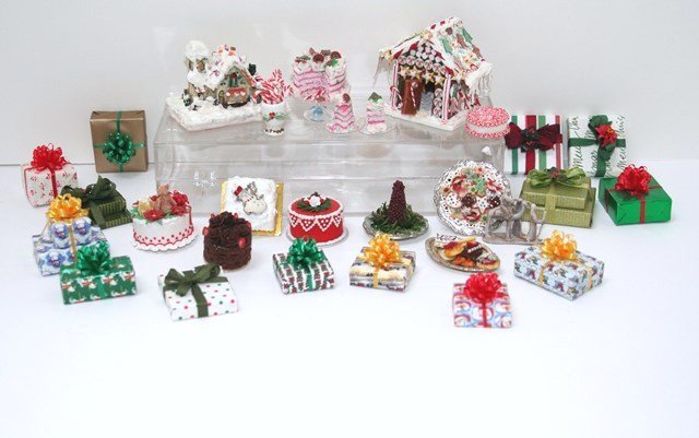 Christmas Celebration: Great assortment of finely crafted Christmas cakes and cookies by Janet Uyetake and other artisans, two gingerbread houses with the taller 1.5" H and a generous number of expertly wrapped gift boxes f
