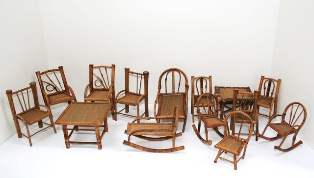 Antique Bamboo Furniture: Over a dozen antique bamboo chairs, chaises, rockers and tables in two scales. The larger chairs measure 5" H while the smaller ones are 4" H. Some loss of trim and comes with three damaged chairs not