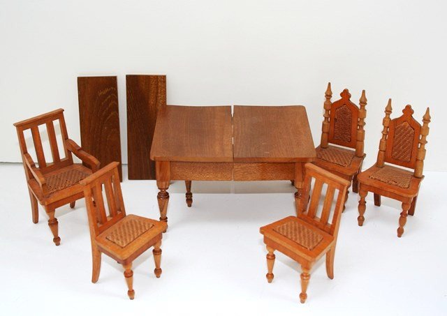 Antique Schneegass Dining Furniture: Five fruitwood chairs and an extending table with both original leaves 3.25" H, 8" L when extended, 4" W. One leaf slightly twisted and top marred with a white ring - these things happen.