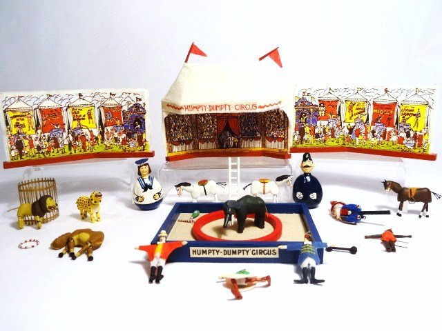 Humpty Dumpty Circus: The Kummerows crafted this miniature version of the famous Schoenhut circus complete with tent, side shows, single ring, and assorted animals and circus performers. Tent 3.75" W, just under 3" H. 22 p