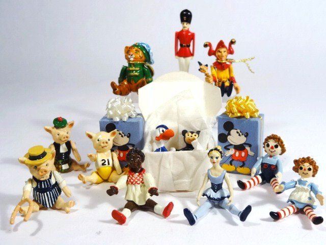 Jointed Pewter Toys: Super assortment of colorfully painted jointed pewter dolls, soldier 1.75" H, and nursery rhyme characters plus Mickey Mouse wrapped gifts. Over a dozen items.