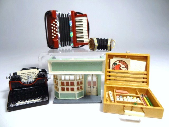 Robert Street Miniatures: Five miniatures by Robert Street: a glitzy accordion, a concertina, fabulous typewriter, a miniature shop and a delightful paint box filled with artist's supplies 1" X 1.5" .