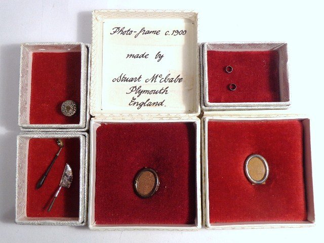 Stuart McCabe Silverware: Two sterling oval frames 5/8" H, a cake server, ladle, trinket box and two napkin rings by English silversmith Stuart McCabe.
