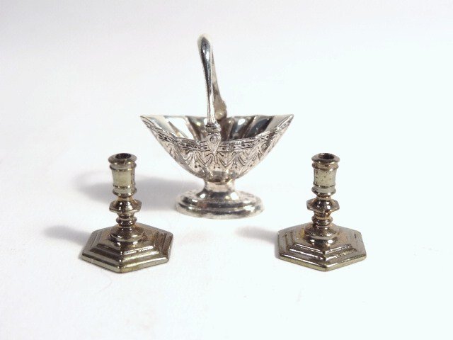 Obadiah Fisher Basket: Delicately engraved sterling basket with swing handle by Obadiah Fisher 1" H and two small pewter candlesticks marked WRR 88. ( William Robinson)