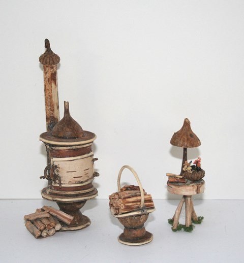 Unusual Twig Furniture: Three pieces of handcrafted twig furniture including an ingenious woodstove 5" H , basket of wooden logs and small table with tiny boots. Perfect for a fairy dwelling! Signed by Donna Harrington Wormw