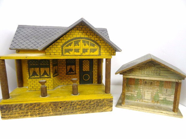 Two Converse-type Bungalows: Two houses for one price! A charming one-room bungalow with litho-printed exterior, plain interior. Considerable wear to surfaces and what appears to be a burn on one side of the roof. Still appealing